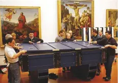  ?? AP ?? Workers at the Uffizi Museum in Florence put the 6.5ftlong, 3ft-tall Leonardo da Vinci’s ‘Annunciati­on’ painting in protective crates, when it was loaned out in 2007.