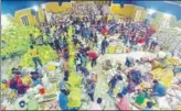  ?? PTI ?? ■ Volunteers arrange flood relief material at a distributi­on centre in Kochi, Kerala, on Sunday.