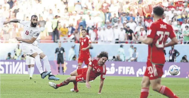  ?? ?? Wales midfielder Joe Allen fails to make the block as Iran’s Roozbeh Cheshmi fires the ball into the net late on to give his team a precious lead