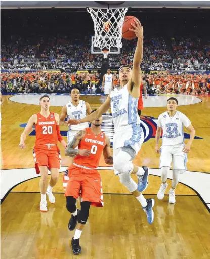  ?? | GETTY IMAGES ?? The Tar Heels bricked their first 11 threes before Marcus Paige sank three key shots from beyond the arc in the second half.