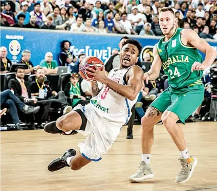  ?? (FOTO GRABBED FROM FIBA.COM) ?? SLIP. Calvin Abueva slips as he goes for a drive against Australia in the World Cup qualifiers. The Beast finished with five points in 19 minutes of action.