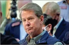  ?? Ap-brynn Anderson ?? Georgia Gov. Brian Kemp listens to a question during a news conference at the State Capitol on April 3 in Atlanta, about Major League Baseball’s decision to pull the 2021 All-star Game from Atlanta over the league’s objection to a new Georgia voting law.