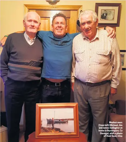  ??  ?? Modest men: (from left) Michael, Jim and James Gallagher at home in Burtonport, Co Donegal, with a photo
of their boat, Irine