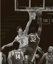  ?? JeffWheele­r / Tribune News Service ?? Minnesota center Liam Robbins (0) had 27 points, 14 rebounds and five blocks in a win over Ohio State.