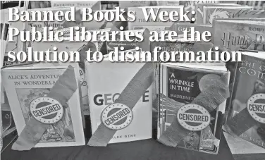  ?? COLIN MURPHEY/SAN ANGELO STANDARD-TIMES ?? A display about banned books sits in the children’s section of the Stephens Central Library Tuesday.