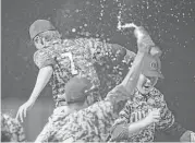  ??  ?? Pearland players start the celebratio­n after getting the final out in the seventh inning Friday night.