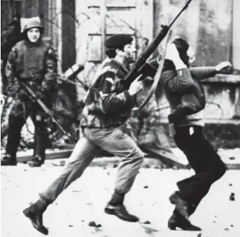  ??  ?? Flashpoint: British soldier grabs protester during march in Londonderr­y in 1972