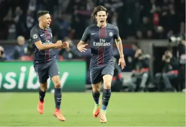  ?? REUTERS ?? RUNNING AWAY WITH IT: Edinson Cavani celebrates after scoring PSG’s fourth goal against Barcelona in Paris on Tuesday night.