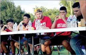  ?? SALLY CARROLL/MCDONALD COUNTY PRESS ?? Several brave participan­ts ate doughnuts as fast as they could during the doughnut eating contest at Noel’s First Friday.