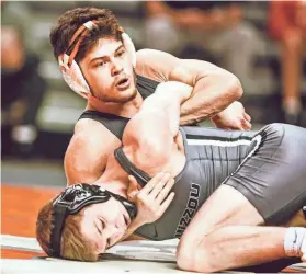  ?? WATERFIELD/OSU ATHLETICS BRUCE ?? Oklahoma State's Reece Witcraft cut weight to get down to 125 pounds as the Cowboys fight through the loss of Trevor Mastrogiov­anni to injury.