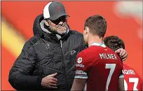  ??  ?? REDS’ RELIEF: Jurgen Klopp hugs James Milner