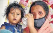  ??  ?? A woman in tears after not finding her name on Shramik Special passengers’ list, in Amritsar on Thursday. SAMEER SEHGAL/HT