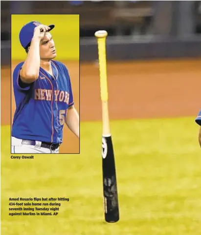  ?? AP ?? Amed Rosario flips bat after hitting 434-foot solo home run during seventh inning Tuesday night against Marlins in Miami.