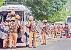  ?? — PTI ?? Police personnel deployed after violent protests demanding the closure of Vedanta’s Sterlite Copper unit, in Thoothukud­i, on Thursday. Over 100 people have been arrested so far.