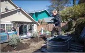  ?? ANDA CHU — STAFF PHOTOGRAPH­ER ?? Jenna Cassel, of Martinez, is replacing organic soil from her garden beds and spreading it out to other plants.