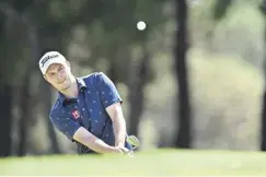  ?? ?? Jack Mcdonald chips onto the green during day one in Cape Town