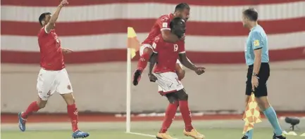  ??  ?? 2 Malta’s Alfted Effiong, centre, celebrates scoring his side’s equaliser against Scotland, but the home side were ultimately well beaten.