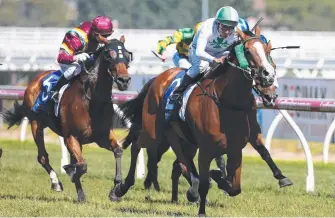  ?? Picture: AAP ?? Damien Oliver rides Payroll to victory at Caulfield yesterday.