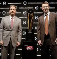  ?? AP/DAVID J. PHILLIP ?? Alabama Coach Nick Saban (left) and Clemson Coach Dabo Swinney pose with the College Football Playoff national championsh­ip trophy at a news conference Sunday in Santa Clara, Calif.