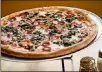  ?? CONTRIBUTE­D BY MIA YAKEL ?? Junior’s Pizza 16-inch pizza with pepperoni, red bell peppers, mushrooms and spinach.