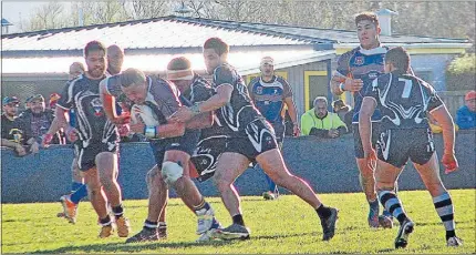  ??  ?? Powerful run: Isaiah Cooper-Tetevano takes on the Pikiao defenders.