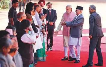  ?? AP ?? Prime Minister Narendra Modi (third from right) introduces Nepalese Prime Minister Khadga Prasad Oli to his cabinet colleagues and other Indian officers in New Delhi yesterday.