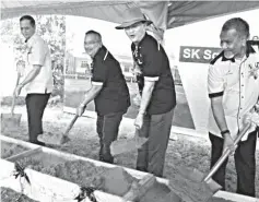  ??  ?? Baru (second right) performs the earth-breaking ceremony. With him are Zohari (second left), Abdul Rahman (right) and Jambai.