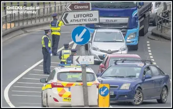  ??  ?? CHECKS Gardai at border yesterday