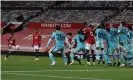  ?? Photograph: Phil Noble/ EPA ?? Bruno Fernandes (left) sends a free-kick past the Liverpool wall to score Manchester United’s winner.