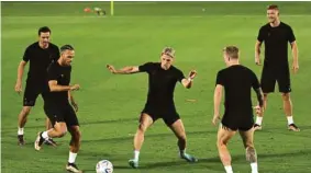  ?? ?? From left: Denmark’s midfielder Thomas Delaney, forward Martin Braithwait­e, defender Jens Stryger Larsen, defender Daniel Wass and forward Andreas Cornelius take part in a training session at the Al Sailiya Stadium yesterday.