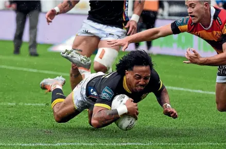  ?? ?? Riley Higgins in action for Wellington against the Mooloos, in their Ranfurly Shield clash at Sky Stadium in Wellington last night. The Lions were victorious in their Shield defence a week after taking it.