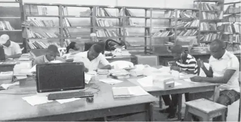  ??  ?? Staff and IT students of the university working on authority catalogue cards that contain comprehens­ive records of library holdings to ascertain records of books lost in the fire