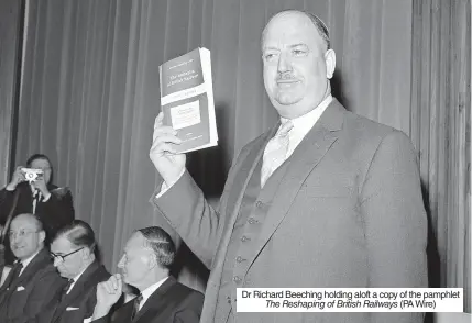  ?? The Reshaping of British Railways ?? Dr Richard Beeching holding aloft a copy of the pamphlet (PA Wire)