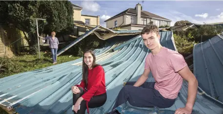  ?? Photos: Mark Condren ?? Ethel O’Donovan and children Seán and Siobhán with part of the roof from Douglas Community School (bottom left). Below: Farmer John O’Connell.