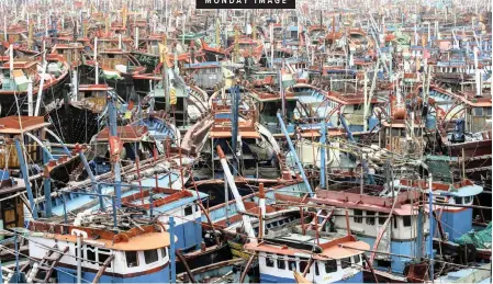  ?? | EPA ?? FISHING boats anchored near the Arabian sea coast, when Cyclone Vayu hit at Veraval, India, recently.