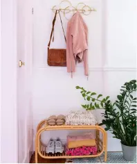  ?? ?? TIDY TIME ‘I painted the hallway white, then added the brass hooks and rattan shoe storage, both from Made.’