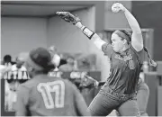  ?? THE OKLAHOMAN]
[PHOTO BY NATE BILLINGS, ?? OU’s Paige Parker, right, gets ready to deliver a pitch on Monday during a 3-0 victory over Tulsa. The Sooners advanced to a super regional in Auburn.