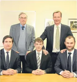  ?? Picture: Gareth Jennings. ?? Seated are the new J&D Wilkie board of Roger McGill (finance director), Hamish Rowan (joint managing director) and Jean-Christophe Granier (joint managing director), with the old board, standing, of Michael Rowan and Bob Low.