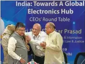  ??  ?? Union Minister for Communicat­ions, Electronic­s and IT Ravi Shankar Prasad is being felicitate­d as he arrives to attend a round table discussion with CEOS' on 'India: Towards A Global Electronic Hub', at Vigyan Bhavan, in New Delhi, Monday