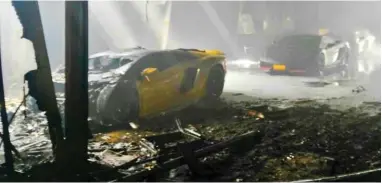  ??  ?? DAMAGED: The yellow sports car, a 2017 model, was destroyed in a fire at Shanfari Automotive in Al Khuwair on Monday morning.