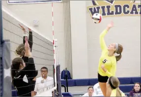  ?? Photo courtesy of Johnson and Wales University ?? John Brown freshman middle hitter Jessica Meyer, No. 5, goes up for a kill during one of JBU’s two matches on Saturday in the Johnson and Wales (Colo.) Invitation­al in Denver.