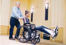  ??  ?? Anthony Borges is wheeled out of a press conference by his grandfathe­r Alfredo Borges in Plantation, Florida. — AFP