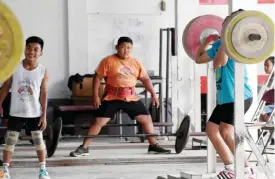  ??  ?? LAMPUNG: Young weightlift­ers training at the ‘elephant club’, a private academy in Pringsewu, a regency of Lampung in Southern Sumatra.