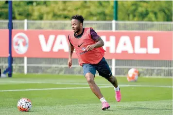  ?? — AFP ?? England striker Raheem Sterling chases the ball during a team training session at Tottenham Hotspur Training Centre in London ahead of their UEFA Euro 2016 qualifying match against Switzerlan­d at Wembley Stadium.