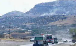  ?? (Shwan Mohammed/AFP via Getty Images) ?? SMOKE BILLOWS on the horizon in the village of Zrgoiz yesterday, 15 km. outside the Iraqi city of Sulaimaniy­ah, where the bases of several Iranian opposition groups are located.