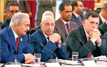  ?? AFP file photo ?? (From left) Khalifa Haftar, Aguila Saleh and Fayez al-Sarraj attend an Internatio­nal Congress on Libya at the Elysee Palace in Paris. on May 29, 2018.—
