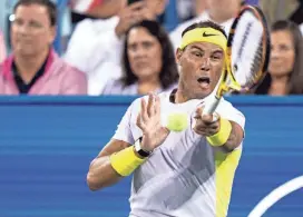  ?? ALBERT CESARE/USA TODAY NETWORK ?? Rafael Nadal hits a return to Borna Coric during the third set of their match in the 2022 Western & Southern Open.