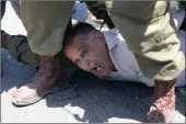  ?? PICTURE: AP ?? Israeli solders arrest a Palestinia­n protester during a demonstrat­ion in solidarity with prisoners on hunger strike in Israeli jails near the settlement of Shavei Shamron near the West Bank city of Nablus on Tuesday.