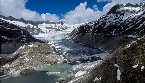  ?? ?? A lake of meltwater has formed on the tongue of the Rhone Glacier near Goms, Switzerlan­d, on 13 June 2023.