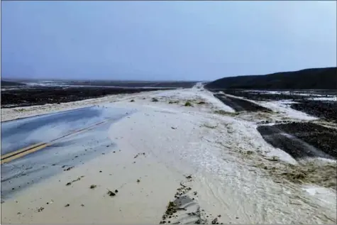  ?? NATIONAL PARK SERVICE VIA AP ?? Highway 190is closed due to flash flooding Aug. 5in Death Valley National Park near the California-Nevada line. The National Weather Service reported that all park roads had been closed after 1to 2inches of rain fell in a short amount of time.